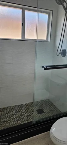 Bathroom featuring toilet and walk in shower