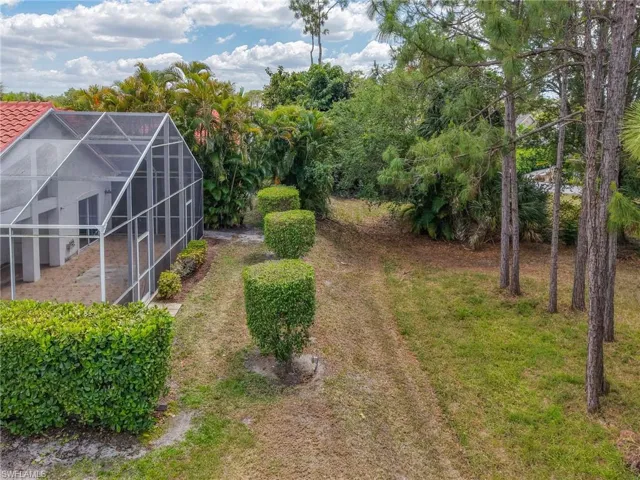 View of yard featuring a lanai