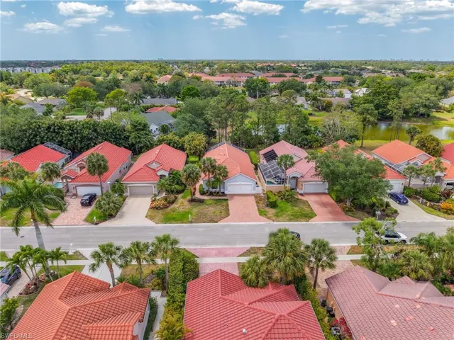 Birds eye view of property with a residential view and a water view