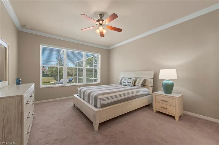 28526 Guiivere Way Bonita Springs FL 34135  - Owner's bedroom with large triple window overlooking the pool and lake