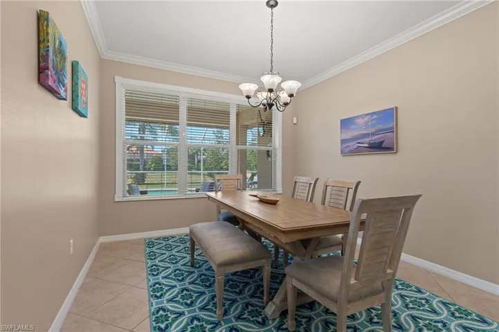28526 Guiivere Way Bonita Springs FL 34135  - Dining area just off kitchen with triple window view to lake and pool