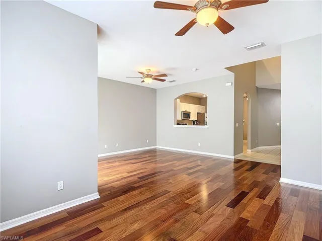 Spare room featuring ceiling fan and hardwood / wood-style floors
