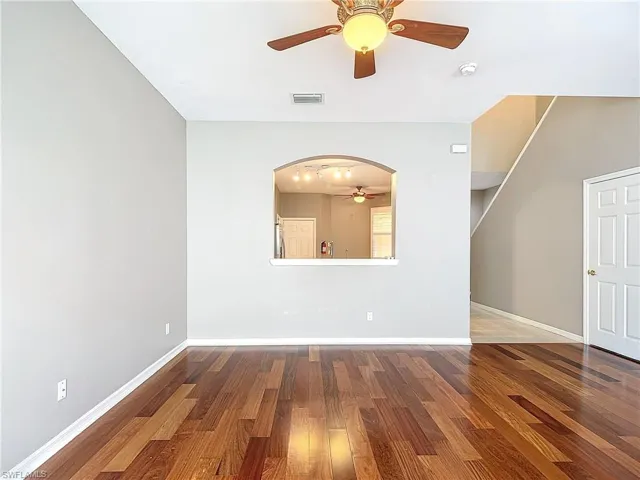 Spare room featuring wood-type flooring and ceiling fan
