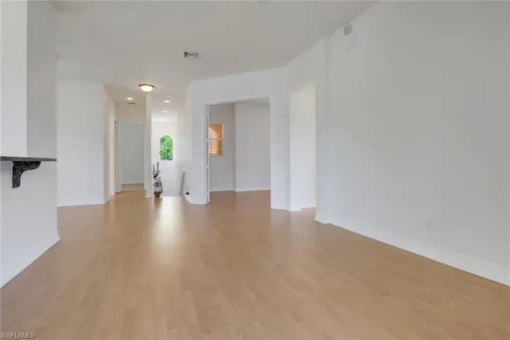 Living Area w/Views of Staircase and Den on the Right