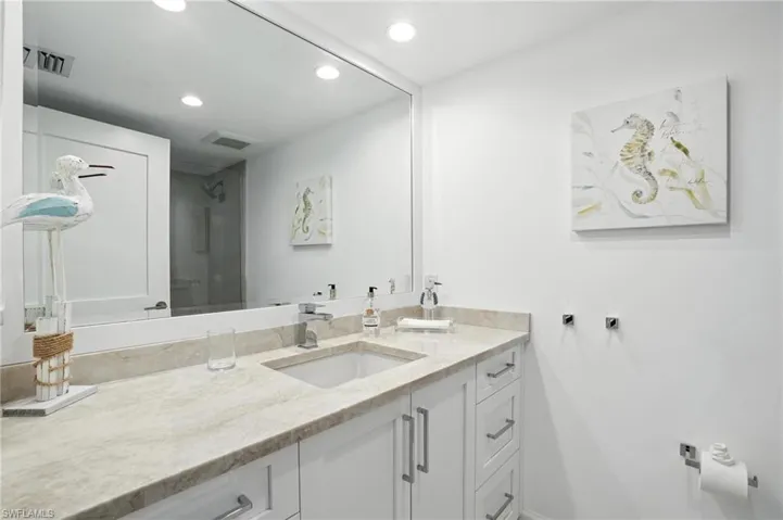 Bathroom featuring vanity and recessed lighting