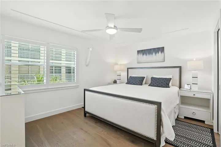 Bedroom featuring wood finished floors and ceiling fan