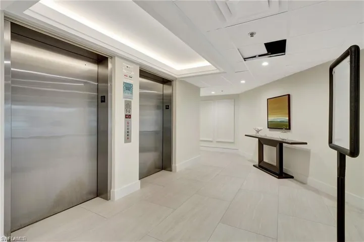 Lobby with elevators, storage rooms and access to the carport, boat dock and recreation facilities