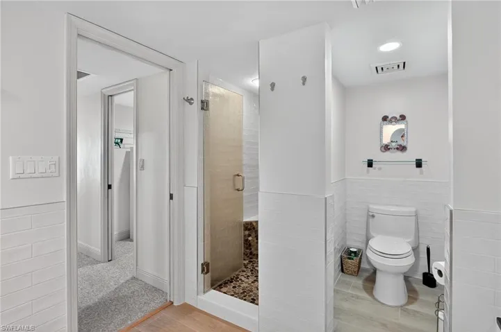 Primary Bathroom with a stall shower and soaking tub