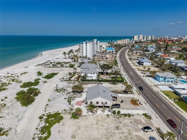 Bird's eye view of waterfront with a beach