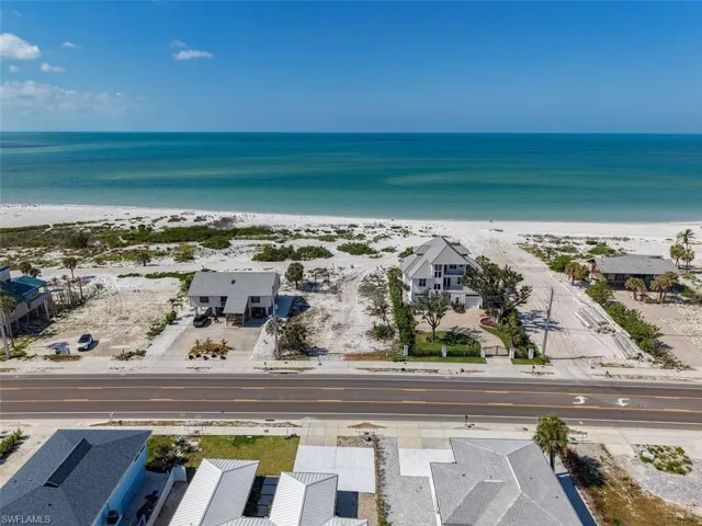 Aerial perspective of suburban area with expansive coastline