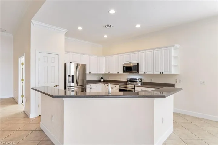 Kitchen with new appliances and Corian counter tops.