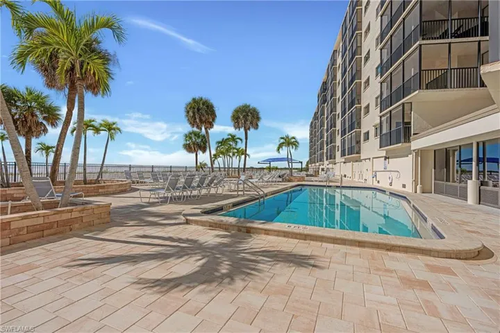 Community pool featuring a patio