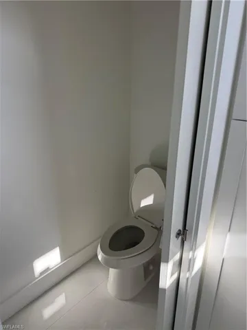 Bathroom with tile patterned floors and toilet