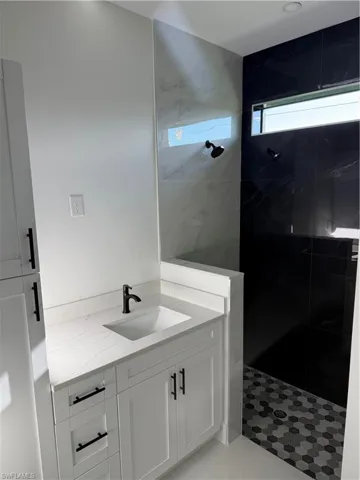 Bathroom with a walk in shower and vanity