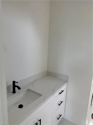 Bathroom with vanity and light tile patterned floors