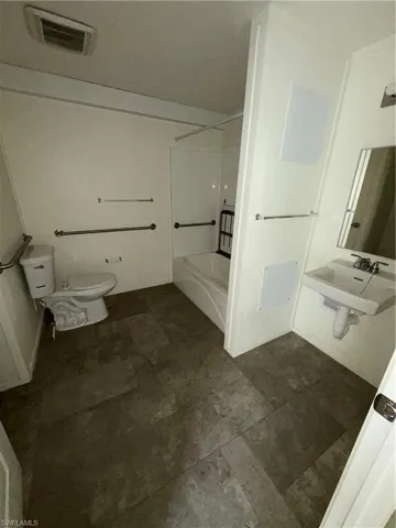 Full bath with toilet, shower / bath combination, and a sink