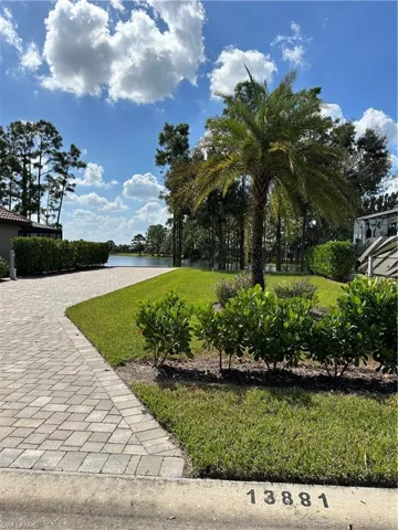 View of home's community featuring a yard