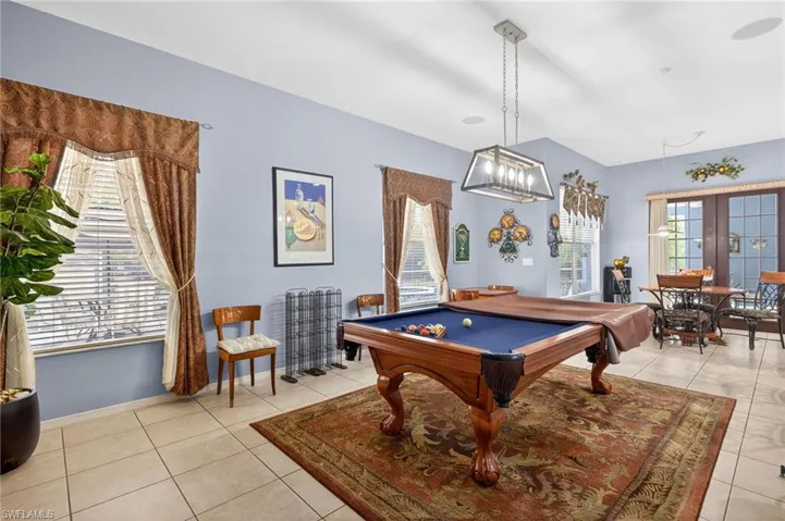 Rec room featuring pool table, french doors, and light tile patterned floors