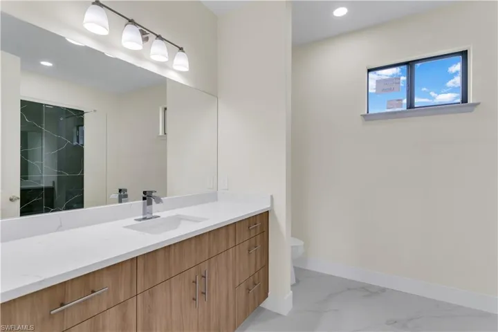 Bathroom with vanity and toilet