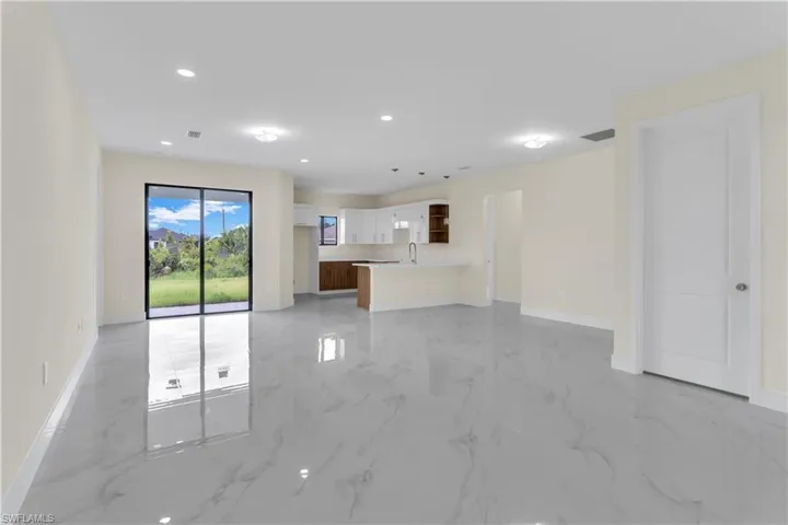 Unfurnished living room with sink