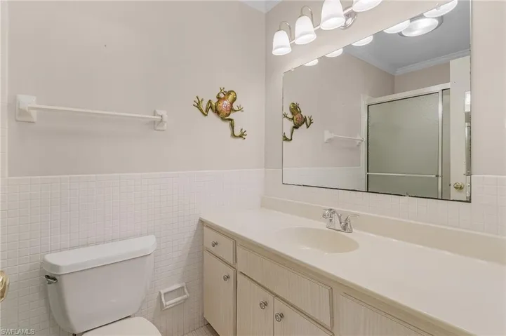 Beautiful white tile is in great shape in the master bathroom
