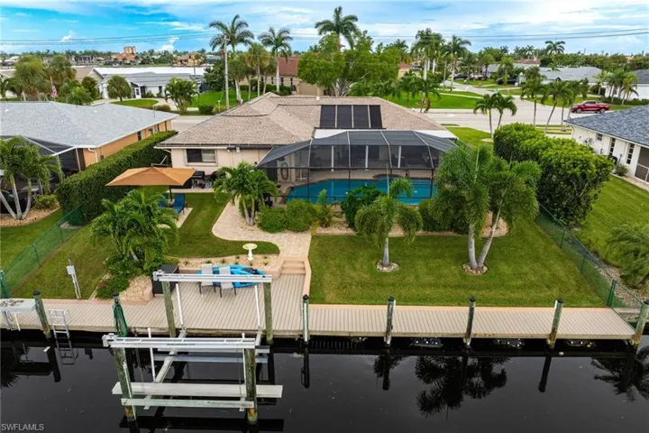 Lush landscaping pool, large newer composite dock and 10,000 lb. boat lift