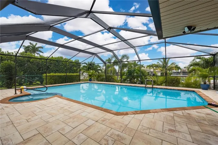 Large 8' deep newly updated pool and integrated spa.