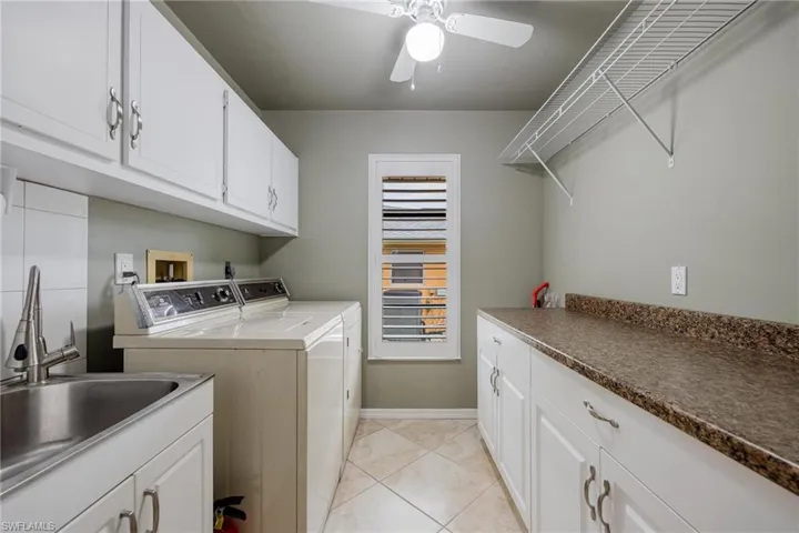 Large with laundry tub and cabinets for storage