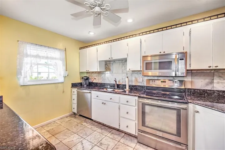 white cabinets, stainless appliances, kitchen