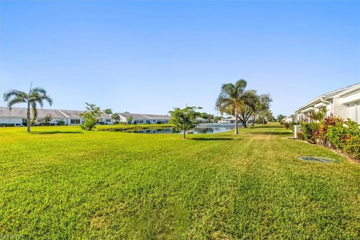 View of yard with a water view