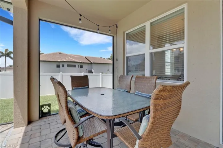 Sunroom featuring outdoor dining area