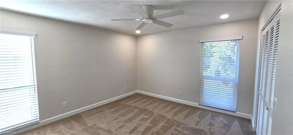 Primary Bedroom Featuring New Carpet, Recessed Lighting, Ceiling Fan & Large Walk-in Closet