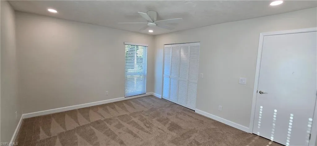 Features Recessed Lighting, New Carpet, Ceiling Fan, & A Large Walk-in Closet