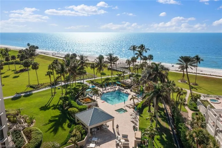 Drone / aerial view with a water view and a view of the beach