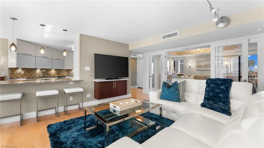 Living room with light hardwood / wood-style flooring