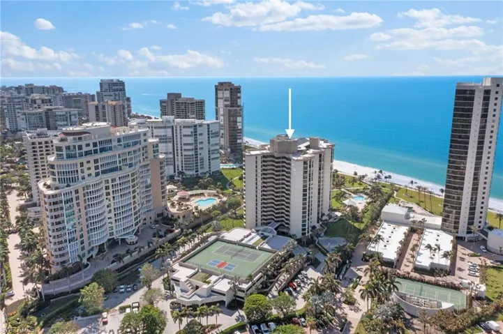Drone / aerial view with a view of the beach and a water view