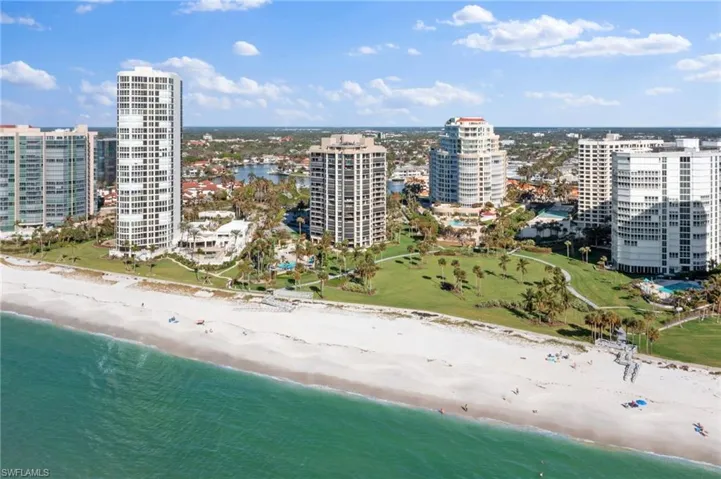 Aerial view featuring a view of the beach and a water view