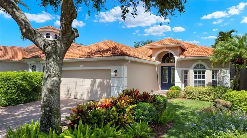 Mediterranean / spanish house featuring a garage