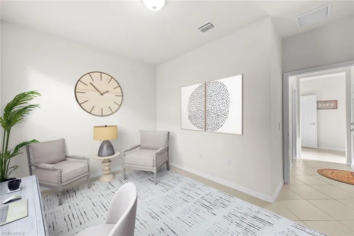 Sitting room with tile patterned flooring and baseboards