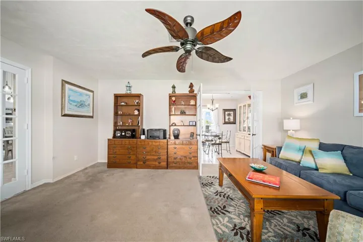 Large living area with French doors to entry hallway