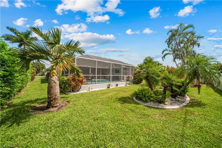 View of yard featuring a lanai