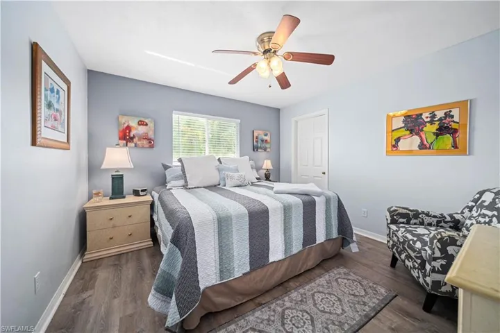 Bedroom with  wood style tile flooring