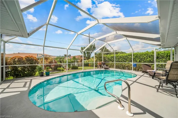 View of pool featuring a lanai and a patio area