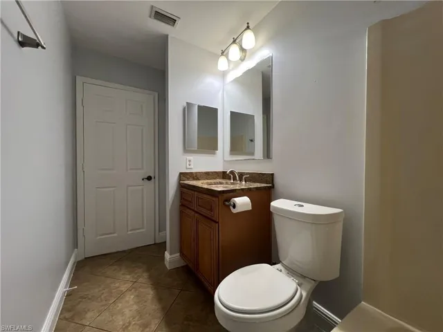 Bathroom featuring vanity and light tile patterned floors
