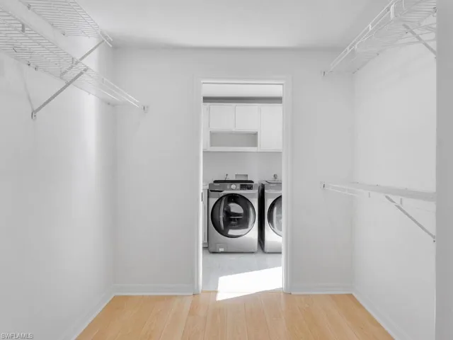 Spacious master bedroom closet that connects to the laundry room/ mud room