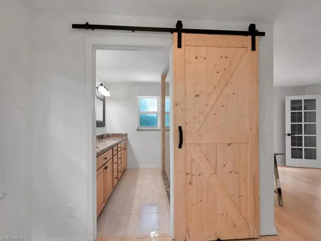Bathroom with vanity and hardwood / wood-style floors