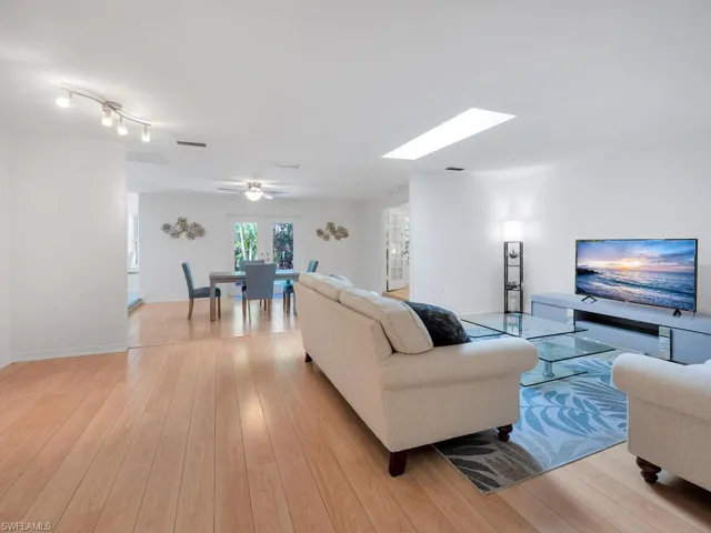 Living room with light wood-type flooring