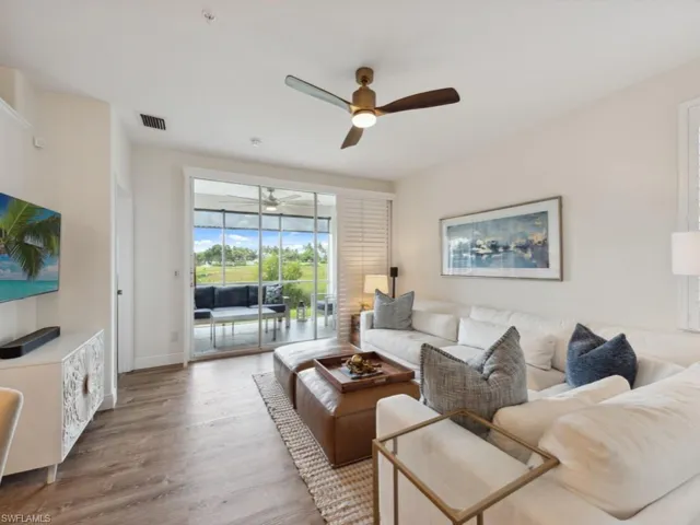 Great room with  wood-style flooring and ceiling fan
