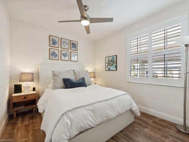 Guest Bedroom featuring  wood-style flooring and ceiling fan
