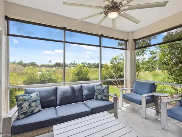 Sunroom featuring New Screens and plenty of natural light, Custom Shades and Upgraded Tile Flooring